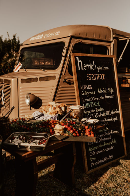 Retro food truck with italian food during boho festival wedding in Germany