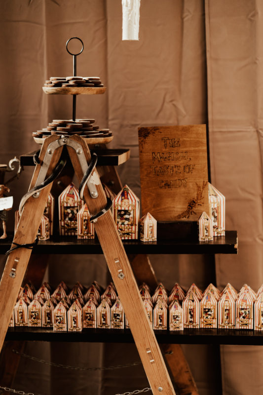 Magical wooden sign together with bertie botts every flavour beans box as Harry Potter wedding details on a boho wedding in Germany