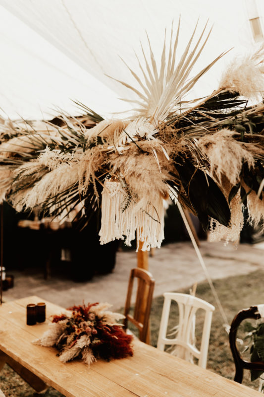 Decor with stretch tent and hanging flowe arrangements for a Bohemian Festival Wedding Germany