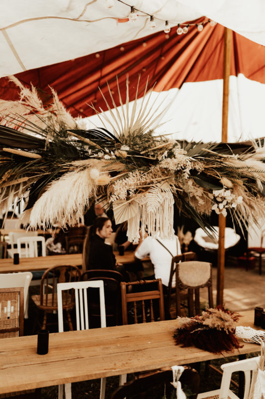 Decor with stretch tent and hanging flowe arrangements for a Bohemian Festival Wedding Germany